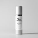 Skincare cream bottle labeled 'Skin Revealing Niacinamide Cream' on a gray background