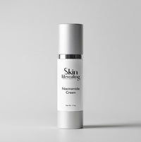 Skincare cream bottle labeled 'Skin Revealing Niacinamide Cream' on a gray background