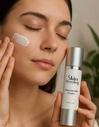 Woman applying Skin Revealing Niacinamide Cream to her face